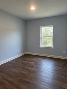 Illustrative finished empty room with blue-gray walls