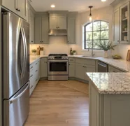 Illustrative finished kitchen with sage-gray cabinetry
